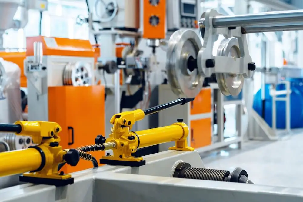 Industrial machinery painting protecting metal equipment components in a manufacturing facility